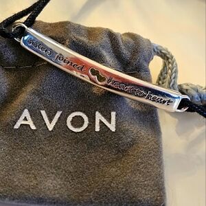 Avon adjustable cord bracelet. "Sisters joined heart to heart."